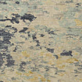 Close-up of the Pias Area Rug showing its hand-knotted texture and contemporary design with beige, blue, and mustard colors. Swatch