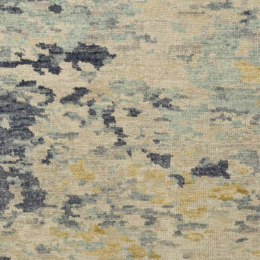 Close-up of the Pias Area Rug showing its hand-knotted texture and contemporary design with beige, blue, and mustard colors. Swatch