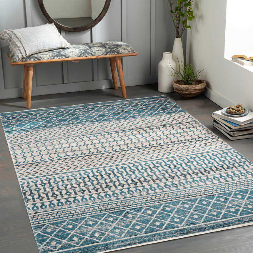 Entryway with Pinamopoan Washable Area Rug in blue, beige, and gray. Bench seating and decor create a welcoming space. Roomscene-Rectangle