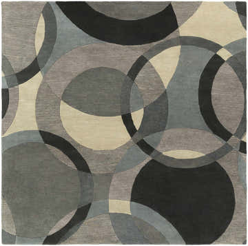 Close-up of the Rilton Gray Wool Carpet, featuring a contemporary circle pattern in black, charcoal, gray, taupe, and teal. Design-Square-8