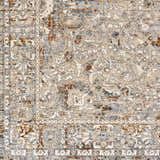 Close-up of the Pambujan Area Rug. Beige, blue, and brown floral pattern with traditional oriental rug design. Swatch