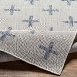 Close-up of Pangao Area Rug showing cream and dark gray woven texture with a geometric plus sign pattern. Fold