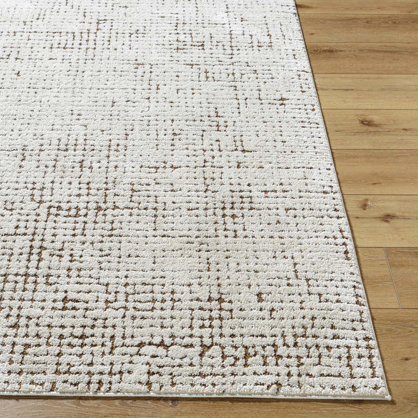 Close-up of the Cascade Minimalist Rug. Ivory rug with a subtle, geometric dark red and medium brown pattern. Front
