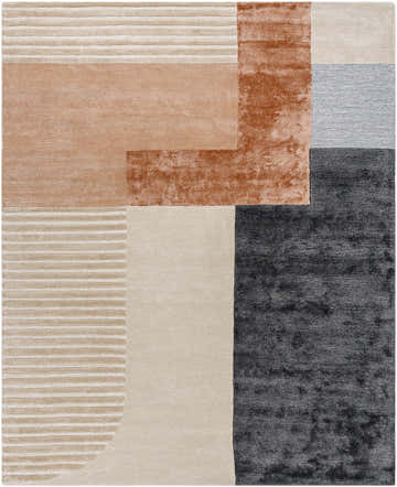 Close-up of the Pofadder Viscose & Wool Patchwork Rug. Geometric design in blue, beige, rust, and charcoal hues. Hand-tufted texture. Design-Rectangle-810