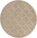 Close-up of the round Posen Area Rug. Tan wool rug with a light tan quatrefoil pattern. Hand-loomed texture. Design-Round-79