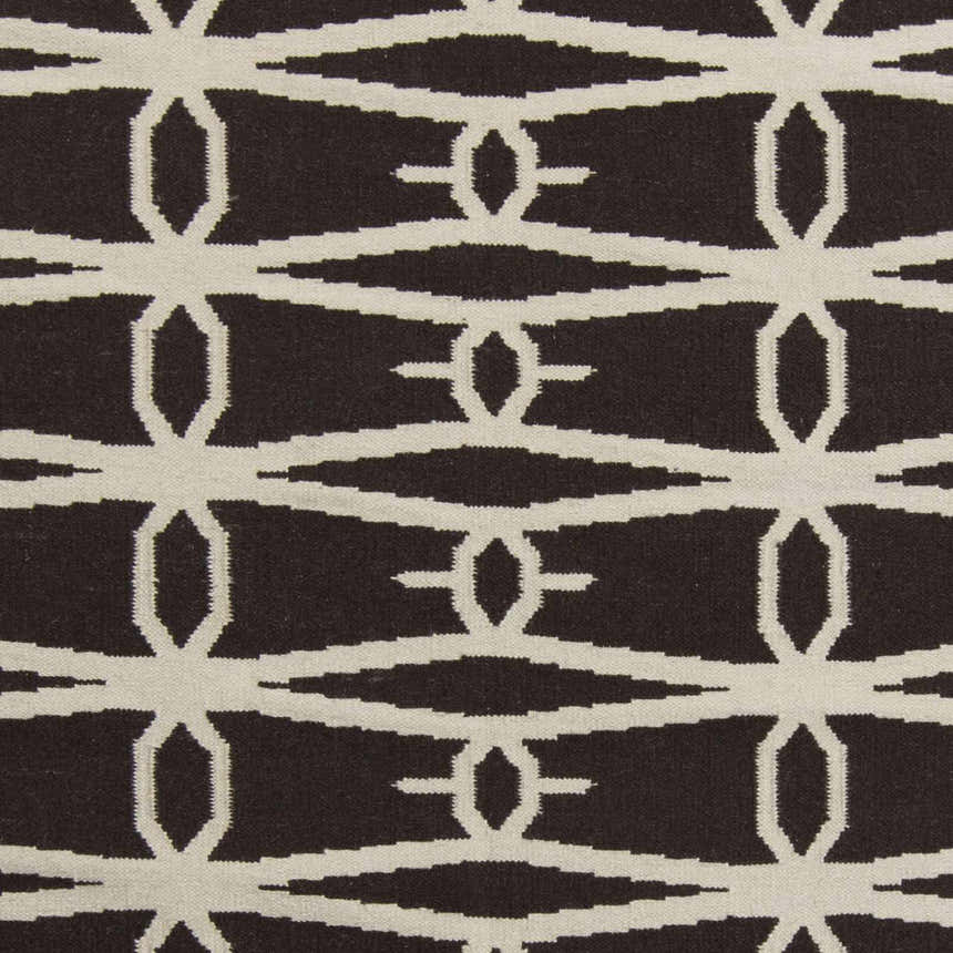 Close-up of the Potsdam Area Rug showing its dark brown and peach geometric, hand woven wool design. Swatch