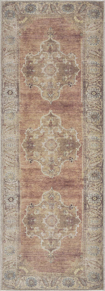 Close-up of the Powhatan Washable Area Rug. Features a traditional oriental pattern in camel, tan, and dark brown colors. Design-Runner