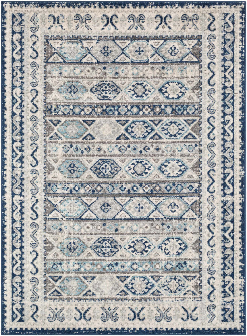 Close-up of the Purdys Area Rug. Bohemian style rug with aqua, charcoal, cream, and blue geometric patterns. Design-Rectangle-5373