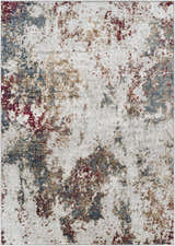 Close-up of the Prinza Area Carpet: a contemporary rug with a mottled pattern in dark gray, gray, nutmeg, taupe, and natural gray. Design-Rectangle-5373
