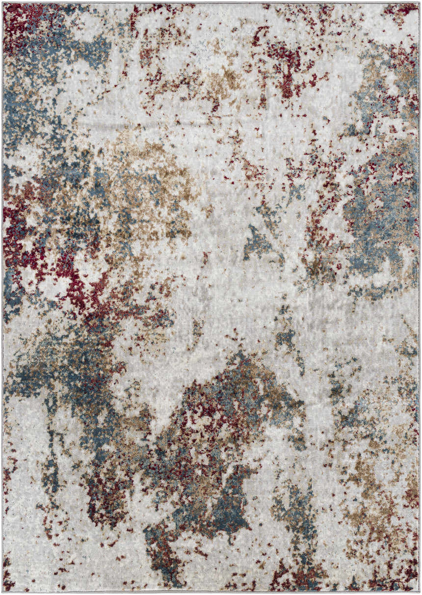Close-up of the Prinza Area Carpet: a contemporary rug with a mottled pattern in dark gray, gray, nutmeg, taupe, and natural gray. Design-Rectangle-5373
