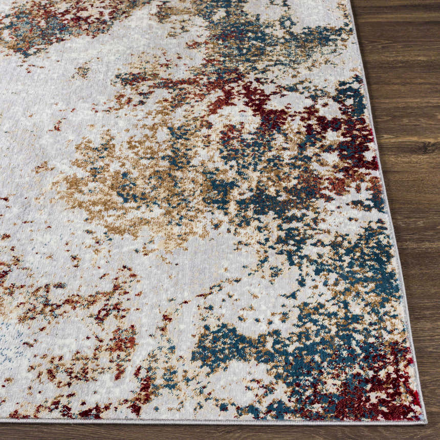 Close-up of the Prinza Area Carpet. Contemporary design with dark gray, gray, nutmeg, and taupe colors. Front