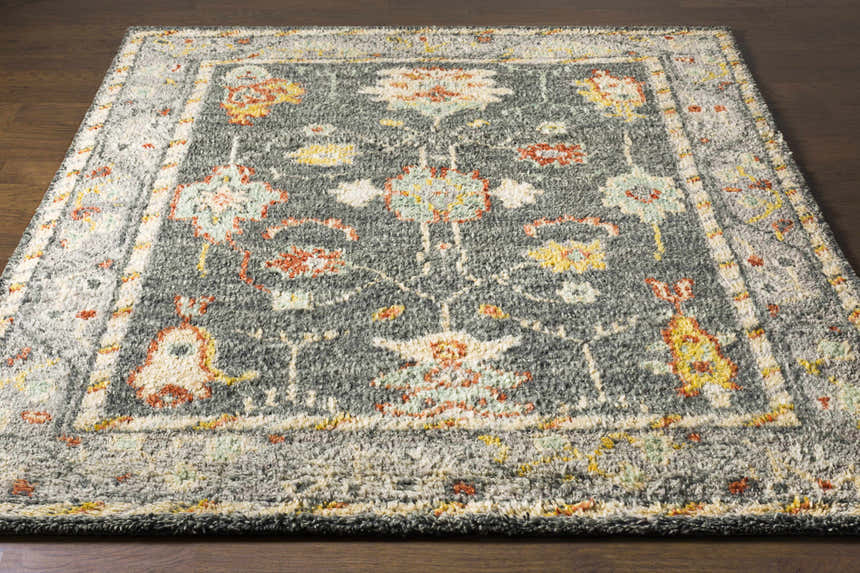 Prosperidad Handmade Wool Rug in brick red, charcoal, cream, and beige. Hand-knotted with a traditional, oriental-inspired pattern. Front