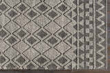Close-up of the hand woven Post Area Rug, a wool runner with a black and white diamond pattern. Swatch