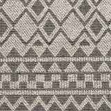 Close-up of the hand woven Post Area Rug. Features a geometric diamond pattern in black and gray wool. Texture