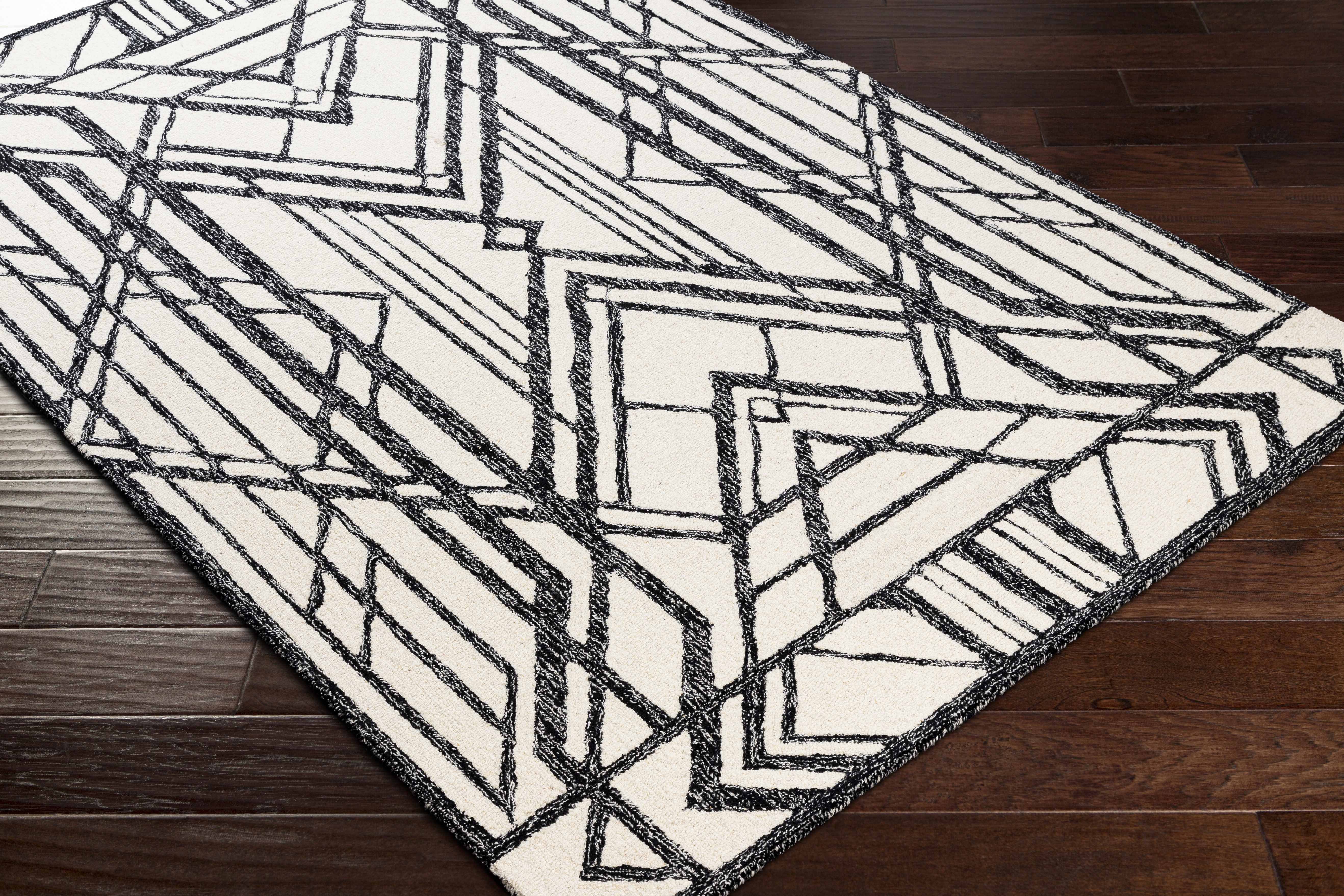 Zoomed-in view of the edge of Pottsgrove Area Rug - Clearance, focusing on border details and craftsmanship. Contemporary Area Rug Backing Canvas 