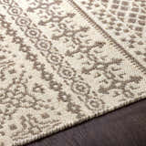 Close-up of the Pumwani Area Carpet. Hand-woven wool rug with cream and gray bohemian pattern. Farmhouse style. Texture