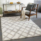 Living room scene with gray chair and white Putat Area Rug with gray diamond pattern. Roomscene-Rectangle