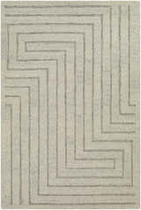 Close-up of the Queenton Area Rug, a hand-tufted wool rug with a geometric pattern in charcoal and light gray. Design-Rectangle-576
