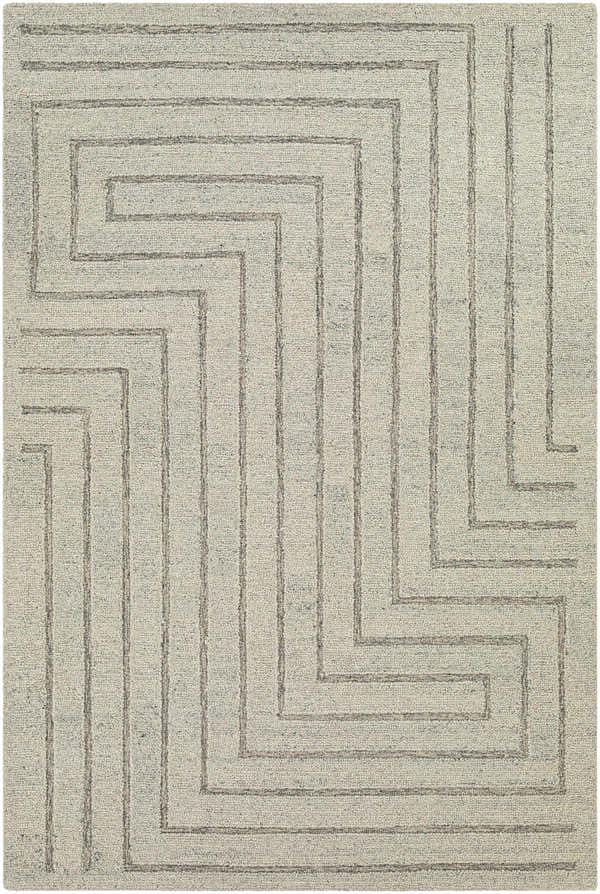 Close-up of the Queenton Area Rug, a hand-tufted wool rug with a geometric pattern in charcoal and light gray. Design-Rectangle-576