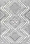 Close-up of the Queanbeyan Area Rug showcasing its geometric diamond pattern in black, gray, and white. Design-Rectangle-5373