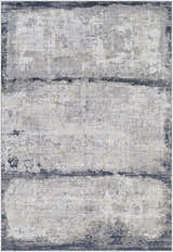 Close-up of the Rainworth Modern Slate Luxe Rug. Charcoal, dark blue, beige, and gray abstract design with a distressed texture. Design-Rectangle-573