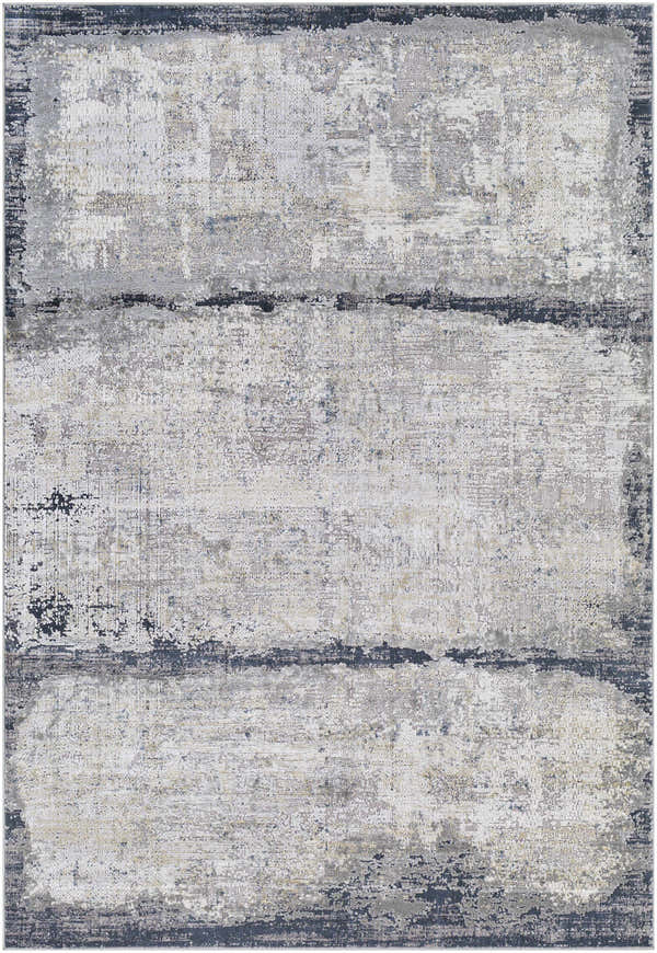 Close-up of the Rainworth Modern Slate Luxe Rug. Charcoal, dark blue, beige, and gray abstract design with a distressed texture. Design-Rectangle-573