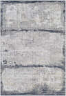 Close-up of the Rainworth Modern Slate Luxe Rug. Charcoal, dark blue, beige, and gray abstract design with a distressed texture. Design-Rectangle-573