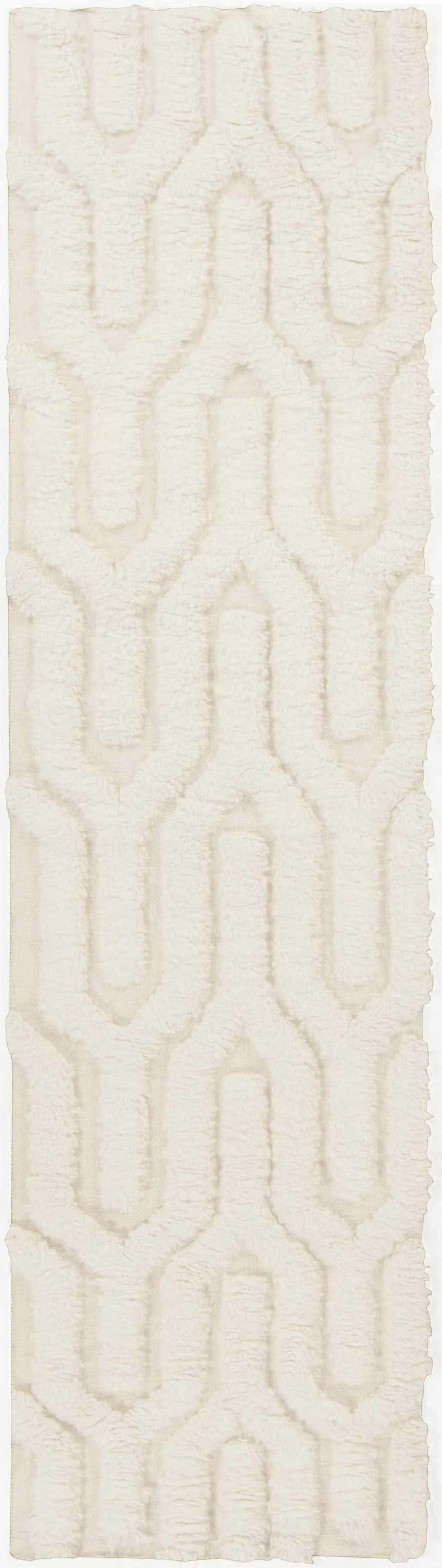 Close up of the cream Ransom Area Rug, a hand woven wool shag rug with a geometric pattern. Design-Runner-268