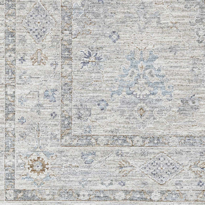 Close-up of Rochedale Area Rug showing traditional pattern in cream, lavender, olive, pale blue, and sage. Machine woven texture. Swatch