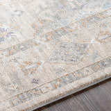 Close up of the Rochedale Area Rug showing cream, lavender, olive, and pale blue traditional pattern and soft texture. Texture