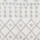 Close-up of the Rick Area Rug showing its gray diamond trellis pattern on an arctic stone background. Hand woven texture. Swatch