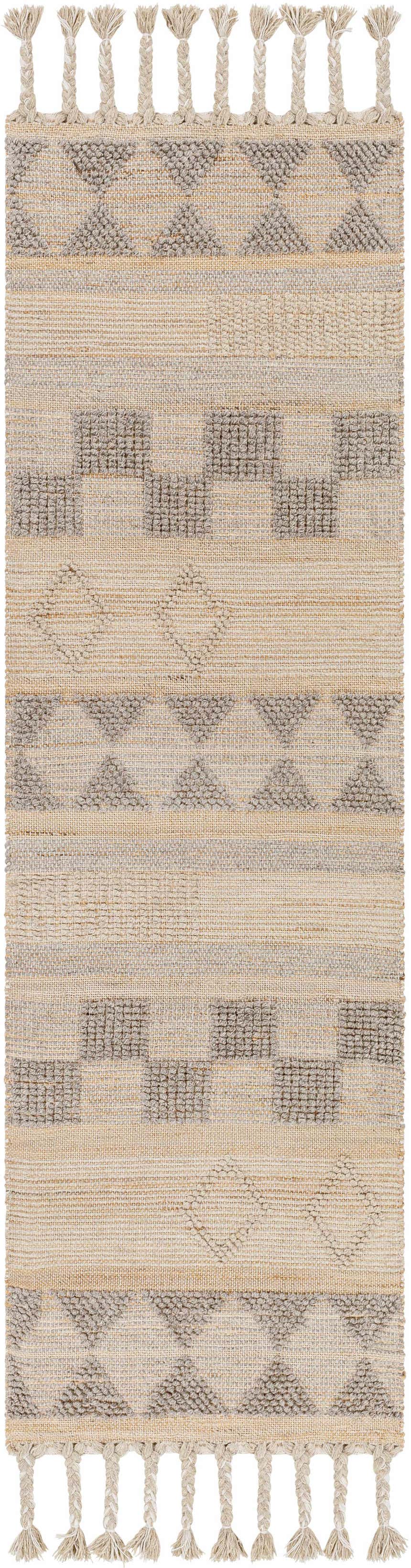 Close-up of the Ardee Totem rug. Tan jute and gray wool blend with geometric patterns and braided fringe detail. Design-Runner-268