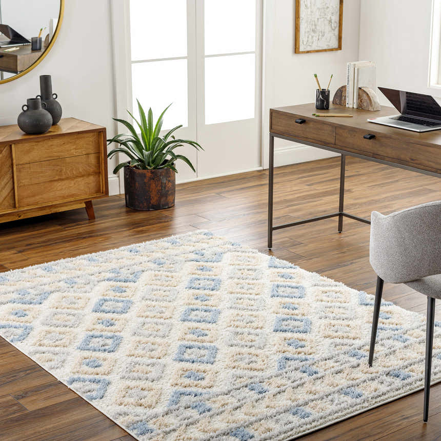 Home office with wood desk and Eivin Pink & Blue Area Rug. Bohemian style with light blue and gray geometric pattern. Roomscene-Rectangle