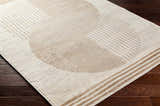 Close-up of the Zeke Geometric Nutmeg Rug showing its linear geometric pattern and neutral nutmeg and ivory colors. Corner
