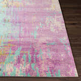 Close-up of the Redland colorful abstract rug showing its magenta, aqua, and gray hues and soft texture. Front