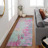 Living room scene with a gray sofa and the Redland Colorful Abstract Rug in aqua, pink, and lavender. Roomscene-Runner