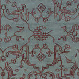 Close-up of the Redvale Area Rug showing its teal background and burgundy, hand-knotted, contemporary pattern. Swatch