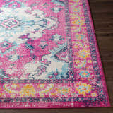 Close-up of the Reedham Magenta Area Rug showing its traditional design, fuchsia, cream, blue, and yellow colors. Front