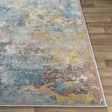 Close-up of the Argo Area Rug showing its contemporary aqua, brown, and mustard abstract design and soft texture. Front