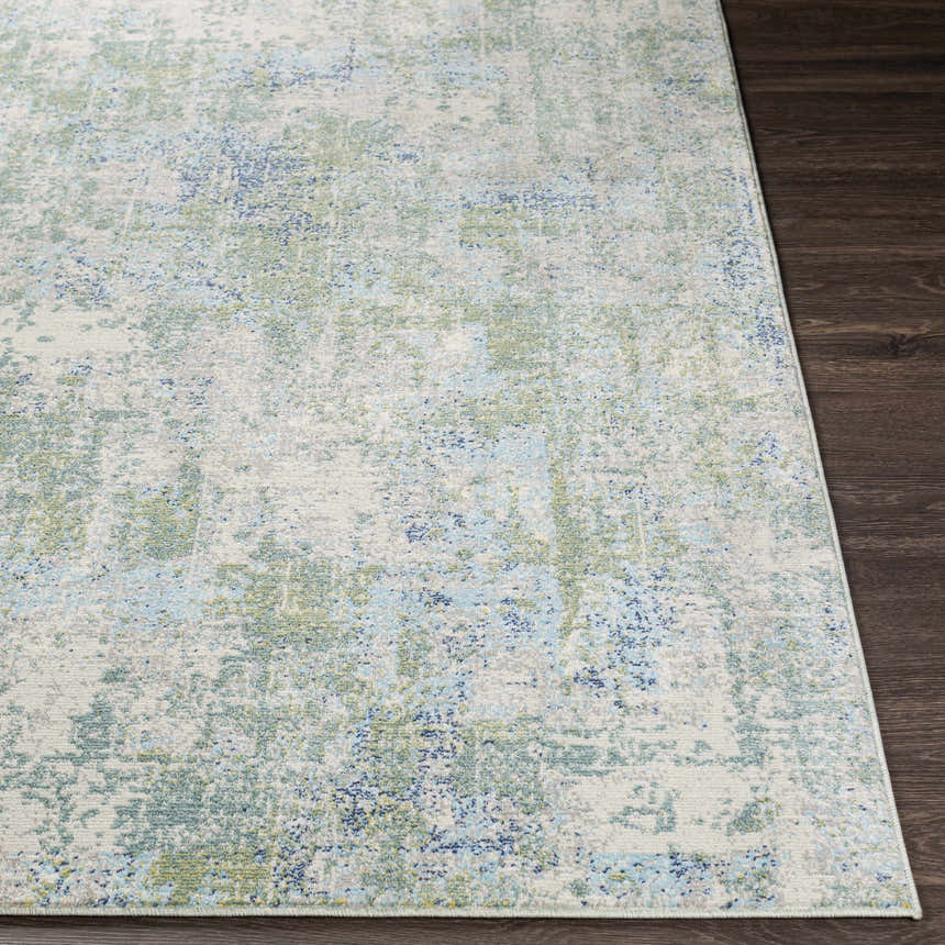 Close-up of the Riegelwood Area Rug showing its light beige, blue, and green contemporary design. Front