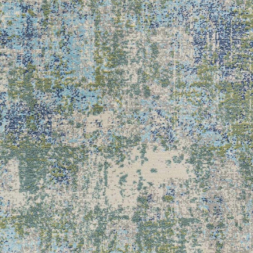 Close-up of the Riegelwood Area Rug, showcasing its abstract pattern in light beige, blue, green, and gray hues. Swatch
