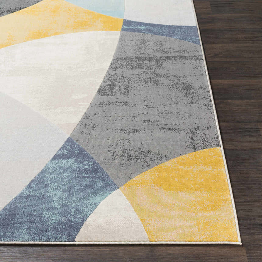 Close-up of Ringgold Area Rug with aqua, charcoal, light slate, mustard, peach, and taupe geometric design. Front