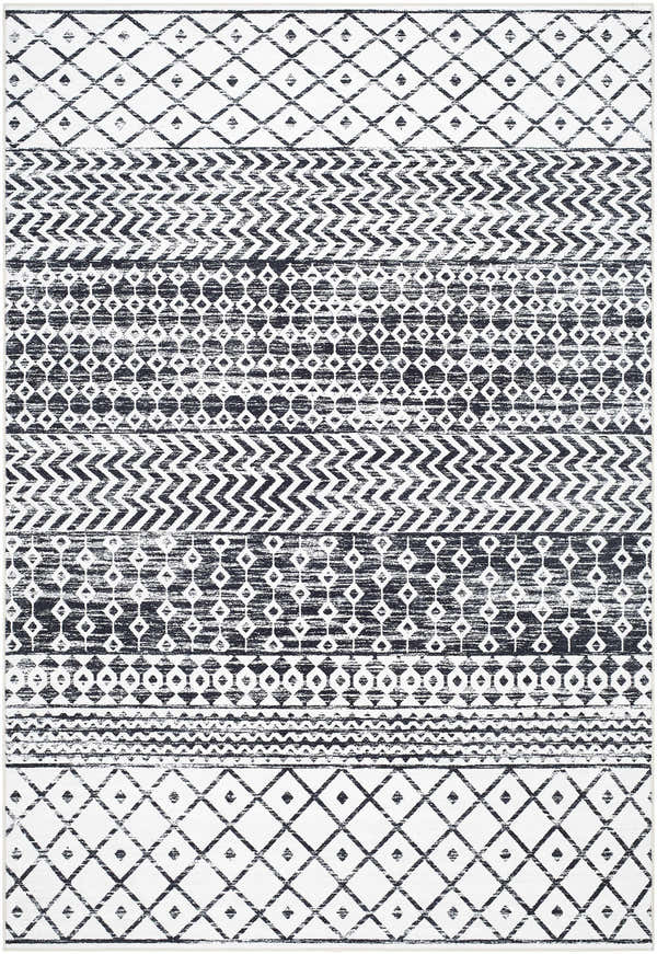 Royko Washable Area Rug with a farmhouse design. Black and white geometric patterns include diamonds, zigzags, and circles. Design-Rectangle-576