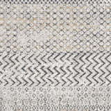 Close-up of the Rombauer Area Rug, showcasing its charcoal, gray, and off-white geometric pattern and distressed texture. Swatch