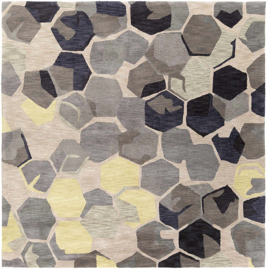 Close-up of the Romoland Area Rug, featuring a contemporary geometric pattern in black, brown, gray, and yellow hues. Design-Square-8