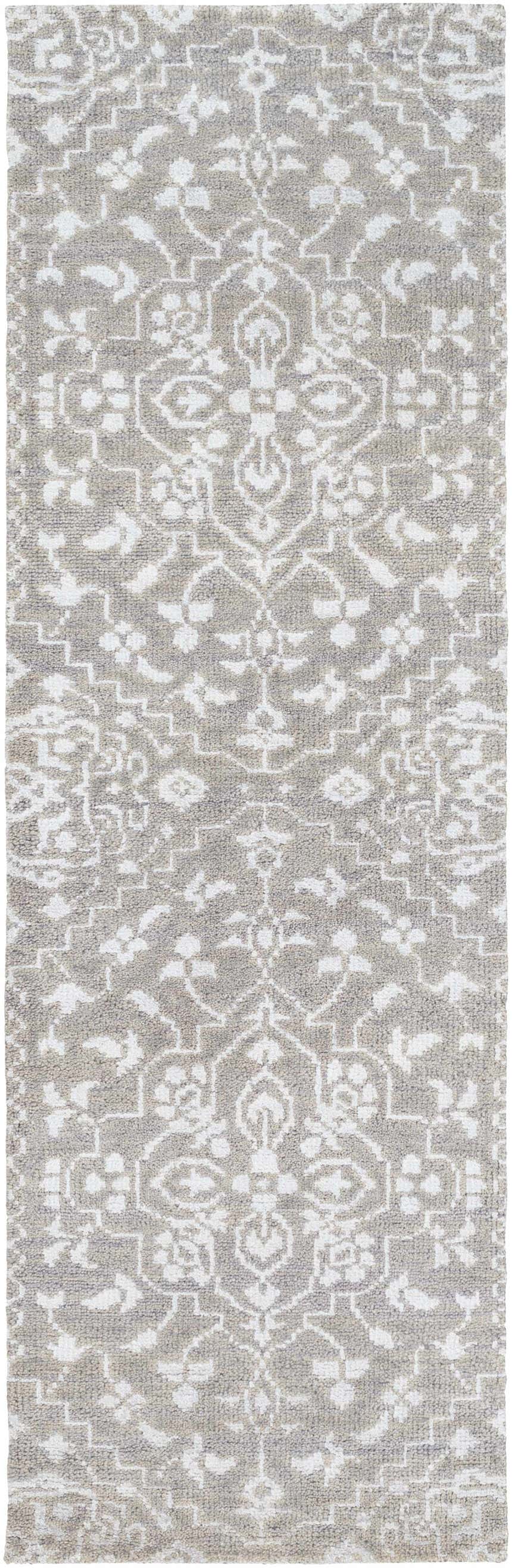 Close-up of the Roxobel Clearance Rug. Farmhouse style rug in light and medium gray with a traditional, hand-knotted pattern. Design-Runner-268