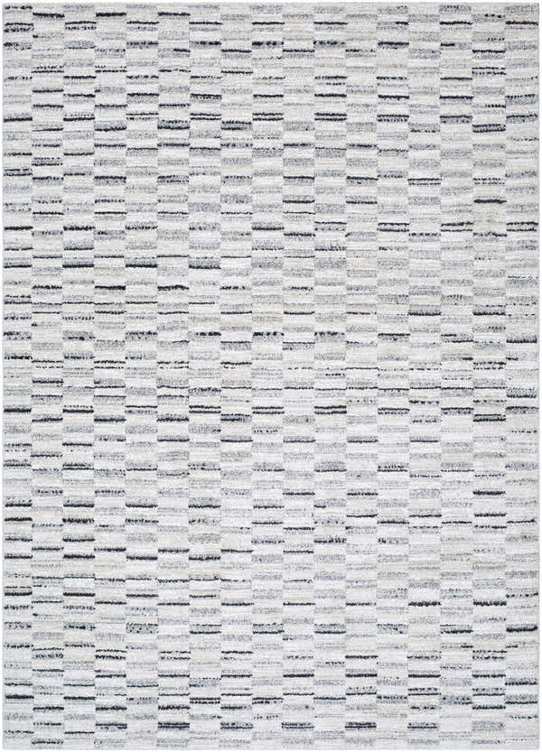 Close-up of the Reece Luxe Rug, featuring a contemporary beige, black, and cream geometric pattern. Design-Rectangle-5373