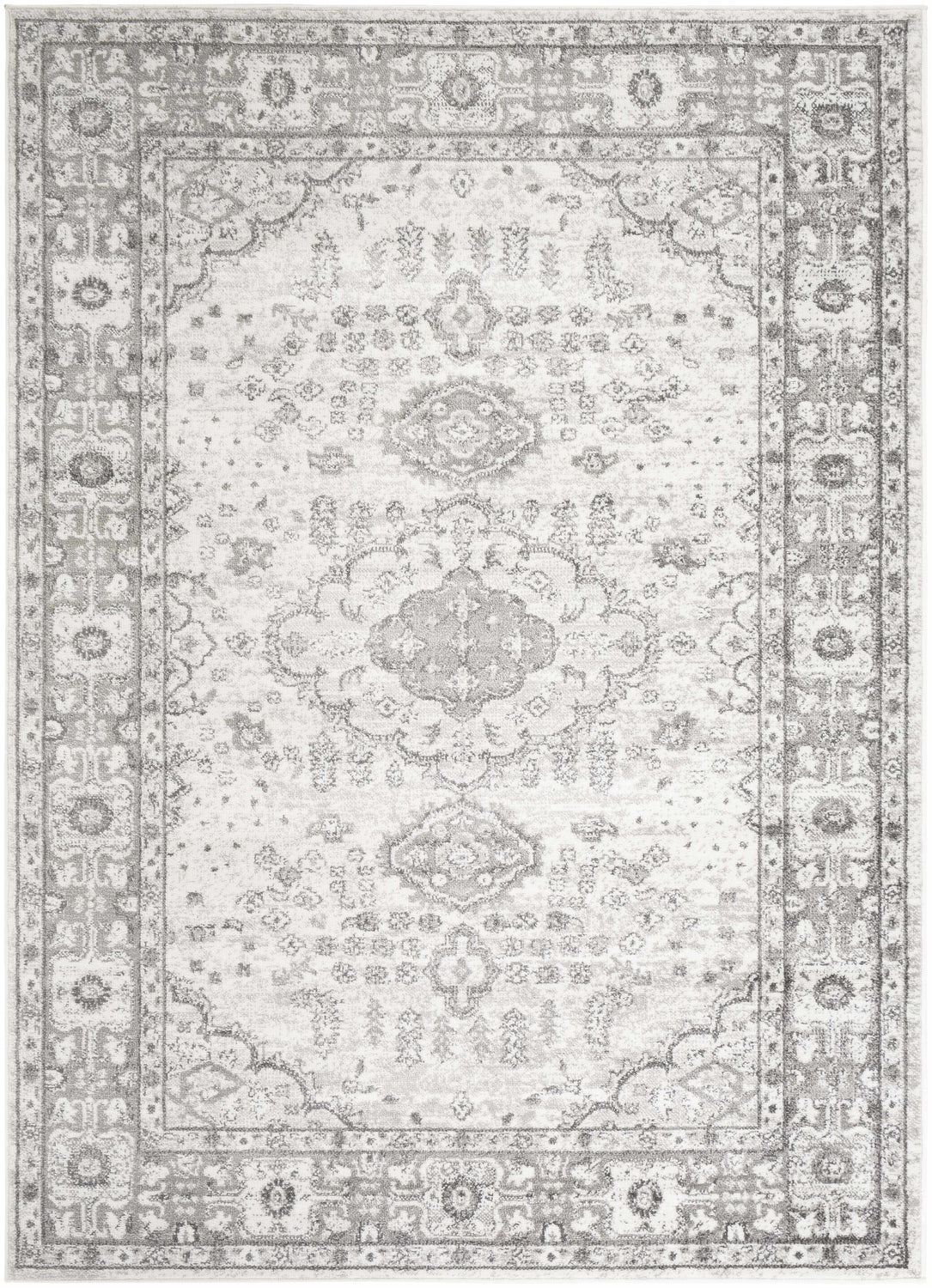 Close-up of the Rueter Area Rug. Charcoal, light gray, and white traditional design with a subtle, distressed pattern. Design-Rectangle-5373