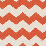 Close-up of the Runnemede Area Rug showing its coral and cream chevron pattern and hand-woven cotton texture. Swatch