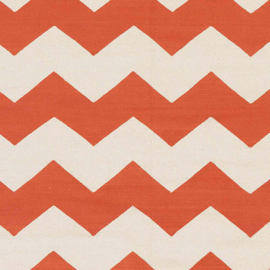 Close-up of the Runnemede Area Rug showing its coral and cream chevron pattern and hand-woven cotton texture. Swatch